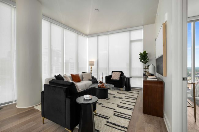 All windows feature light-filtering roller shades. | Image 23