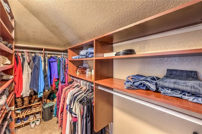Spacious closet with tile patterned flooring and lofted ceiling | Image 31