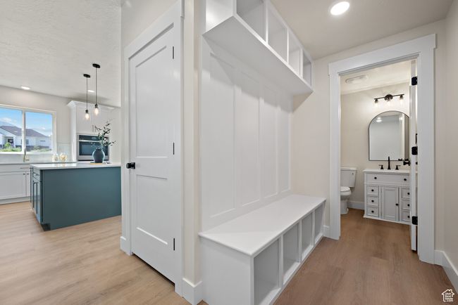Mudroom featuring light wood finished floors and recessed lighting | Image 17