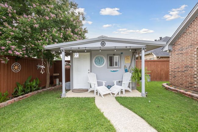 View of outdoor pool house complete with toilet and sink. | Image 27