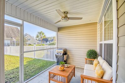 Sunroom featuring ceiling fan and wooden ceiling | Image 3