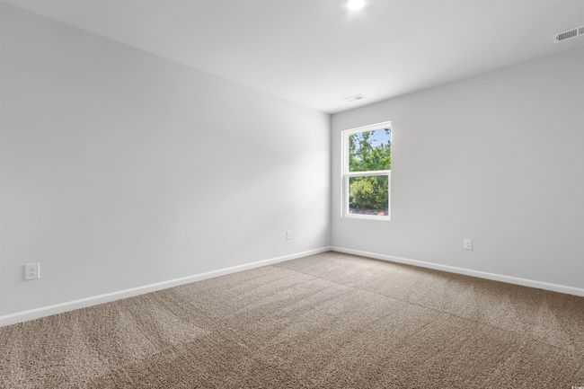 View of carpeted spare room | Image 30