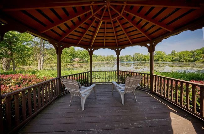Wooden gazebo with a water view | Image 34