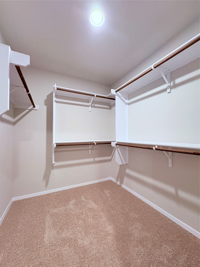 Walk in closet with carpet flooring | Image 35