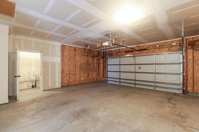 Garage featuring a garage door opener | Image 5