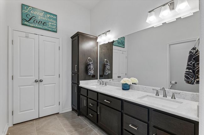 Full bathroom featuring tile patterned flooring, a sink, and double vanity | Image 23