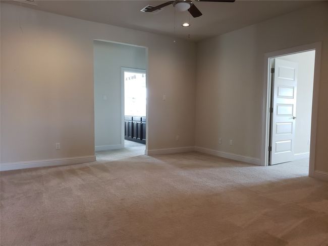 Unfurnished room featuring light carpet, ceiling fan, and recessed lighting | Image 12