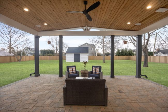 View of patio / terrace featuring a fenced backyard, an outbuilding, and a storage shed | Image 4