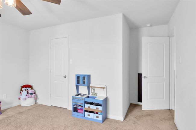Rec room featuring carpet flooring, baseboards, and a ceiling fan | Image 22