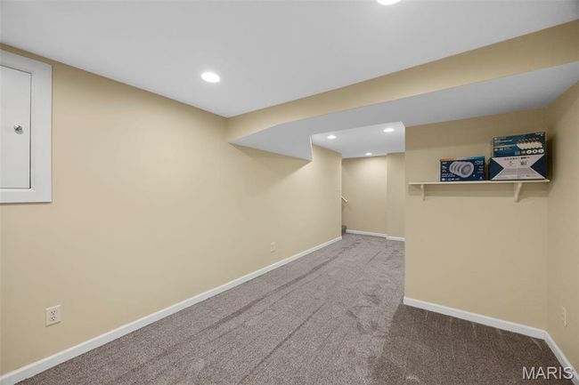 Finished below grade area featuring carpet and recessed lighting | Image 26