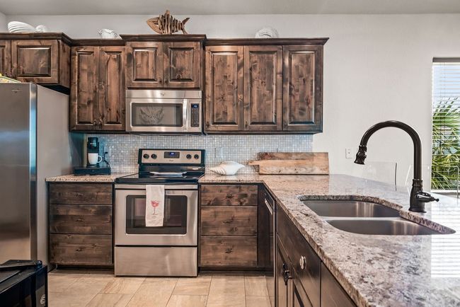 Clean, comfortable kichen with large island | Image 17