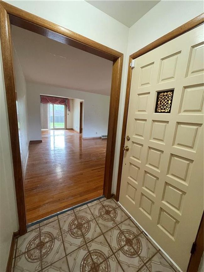 Doorway with visible vents, light wood- | Image 6