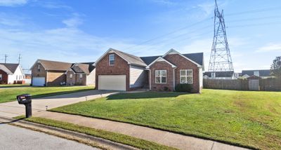 The subdivision has sidewalks for late afternoon strolls. | Image 3