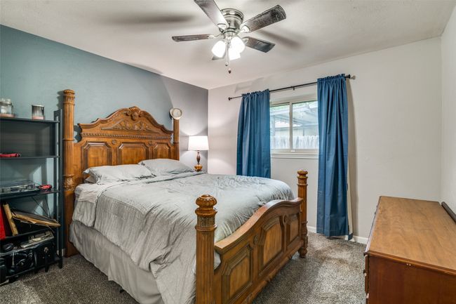 Carpeted bedroom featuring a ceiling fan and baseboards | Image 20