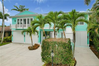 FROM THE LEFT TO THE RIGHTSIDE LARGE GARAGE, IN THE MIDDLE A GARAGE, WORKSHOP, GQARAQGE AGAIN.ALL GARAGES OPEN FROM FRONT TO BACK. BALANCY WITH FRENCH DOORS ALL IMPAQCT WINDOWS AND DOORS. PINEAPPLE LIGHTS. NEW SOLAR PANELS ON THE METAL ROOF. DRIVEWAY WIDE. | Image 1