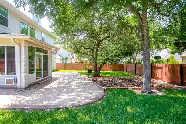Fenced backyard featuring a patio area | Image 34
