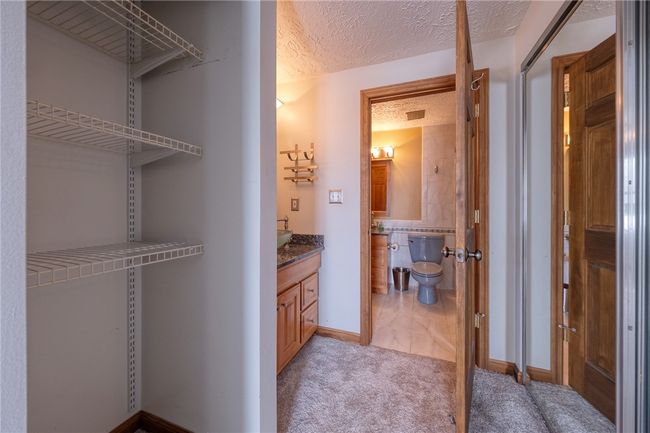closet and vanity area off bedroom | Image 12