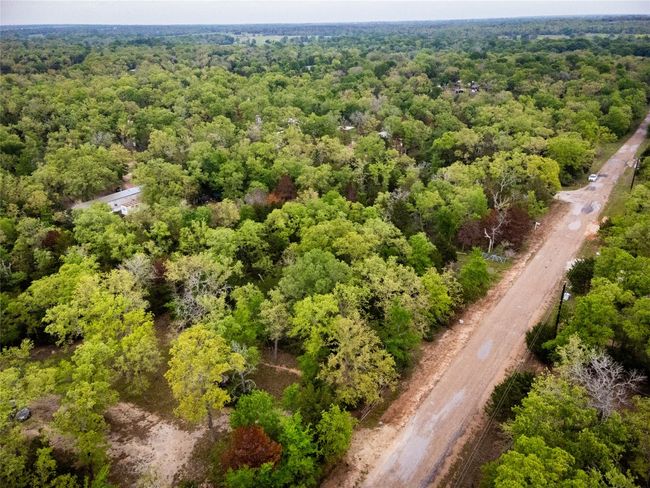 Birds eye view of property with a wooded view | Image 7