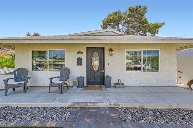 Property entrance featuring stucco siding and a patio area | Image 5