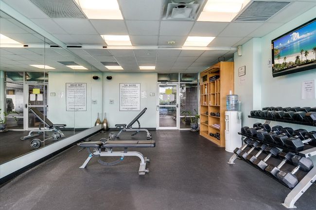 Workout area featuring visible vents and a drop ceiling | Image 24