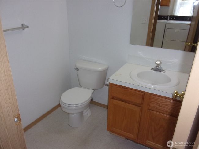 Handy half-bath near the laundry room. | Image 22