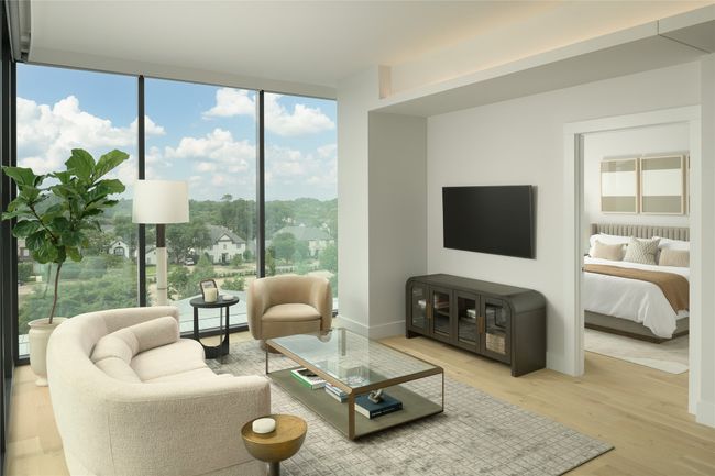 Living area with floor to ceiling windows and wood finished floors | Image 6