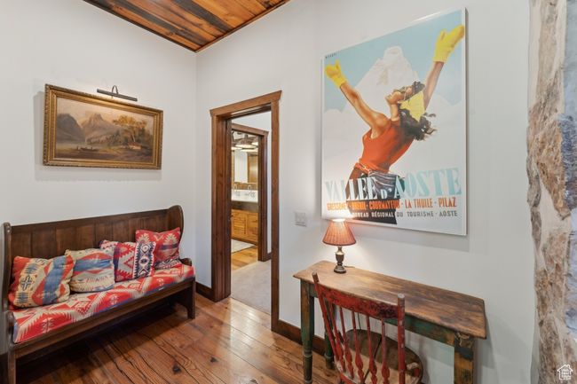 Living area with wood-type flooring and baseboards | Image 28