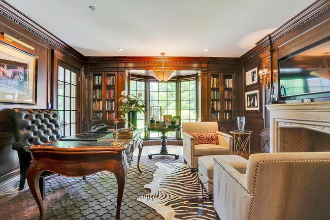 Den/office w. Chesney marble fireplace and custom cabinetry w. TV | Image 8
