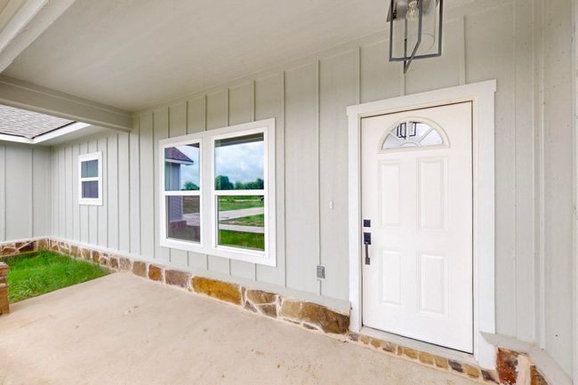 View of exterior entry with a patio area | Image 13