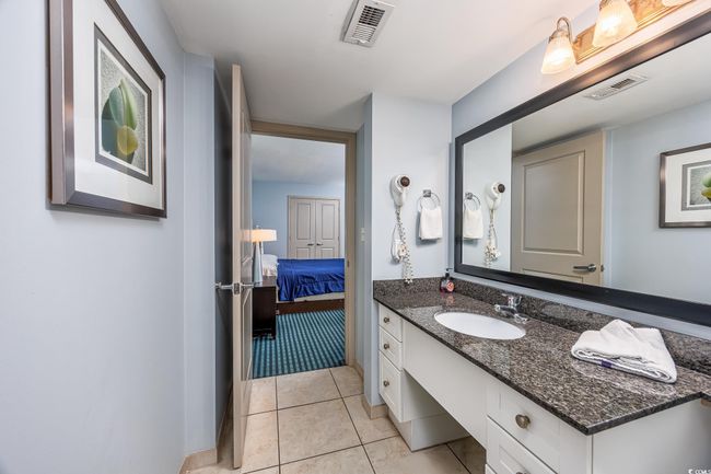 Bathroom with tile patterned flooring, visible vents, vanity, and ensuite bathroom | Image 12
