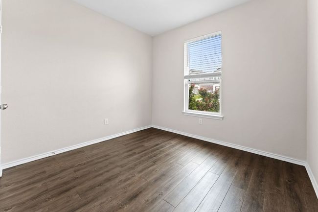 Guest 1 room featuring baseboards and dark wood finished floors | Image 20