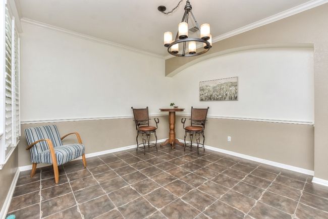 The previous owners used this flexible area as a casual bar/entertaining space. | Image 4