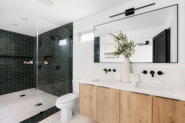 Spa like master bathroom with marble floors, floating dual vanity and huge walk in shower! | Image 19