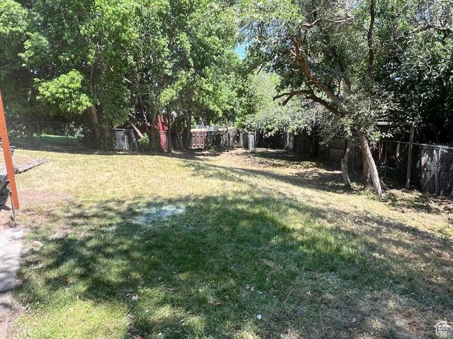 View of fenced backyard | Image 33
