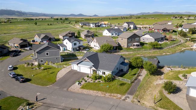 Aerial view of property's location featuring a water and mountain view and nearby suburban area | Image 38