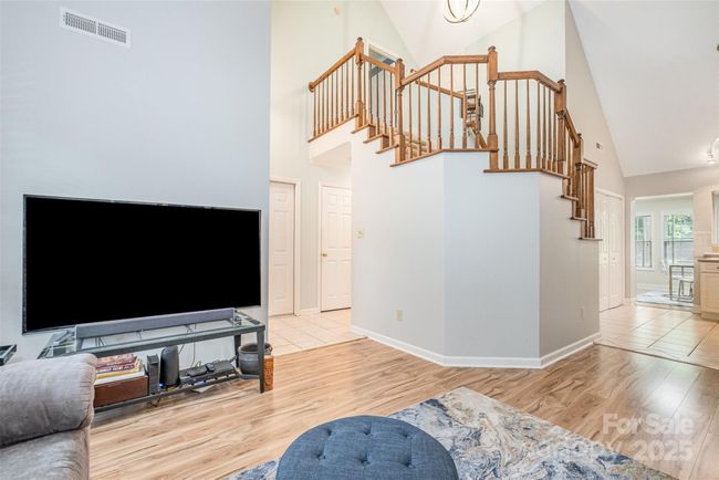 Central staircase leads to an upstairs landing | Image 8
