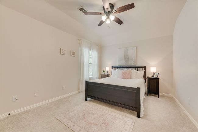 Bedroom featuring light carpet, baseboards, and a ceiling fan | Image 25