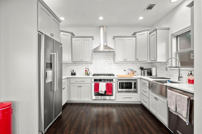 Kitchen is equipped with a gas cook top & Kitchen Aid Appliances. | Image 8