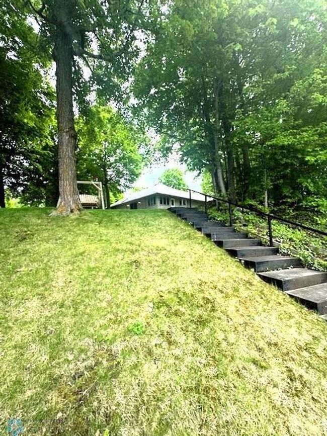 Stairs/Slight slope to lake from subject property | Image 16