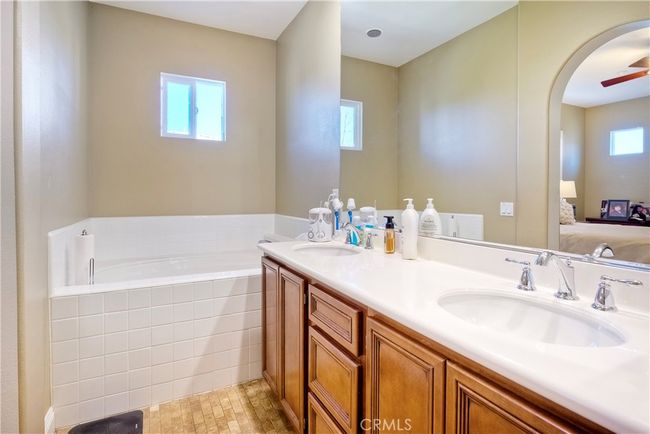 Deep soaking tub for relaxing, in primary ensuite bath | Image 30