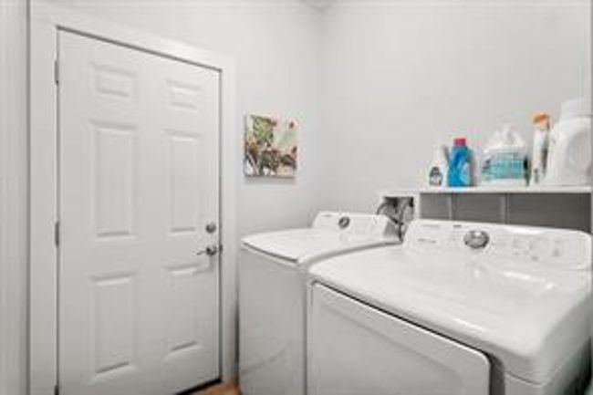 Washroom featuring washer and dryer and laundry area | Image 19