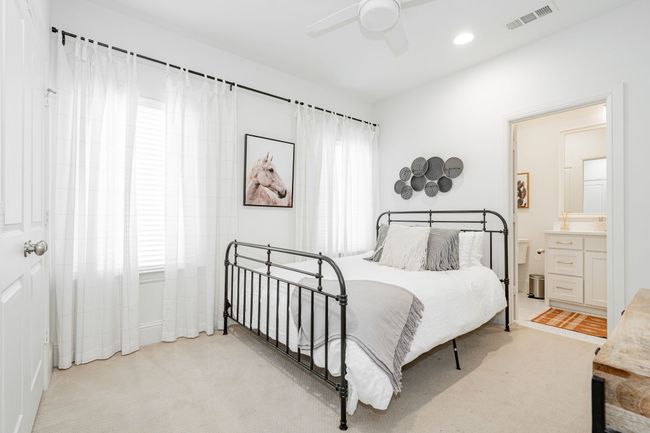 Bedroom with queen sized bed, recessed lighting, ensuite Jack and Jill bath, and light carpet | Image 32