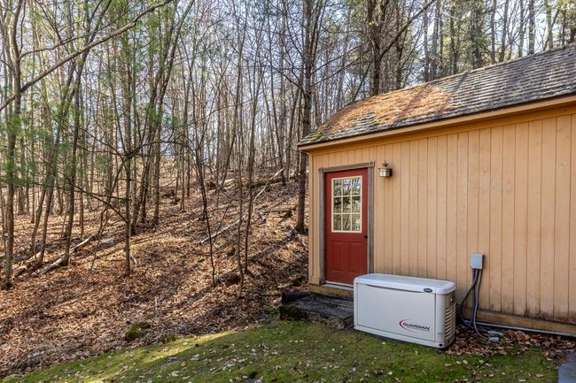 View of yard with an outdoor structure and fence | Image 10