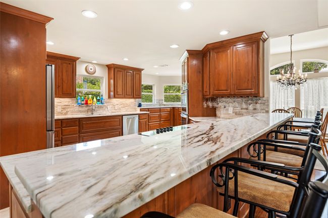 Look at this beautiful kitchen featuring marble countertops | Image 4