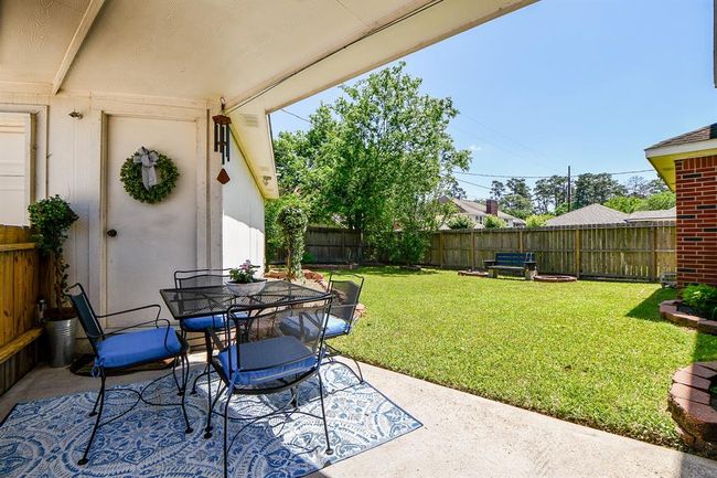 Patio off front the back yard area | Image 32