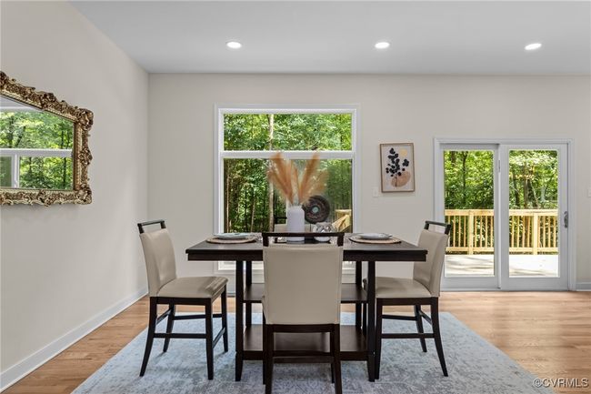 Dining area with wood finished floors and recessed lighting | Image 18