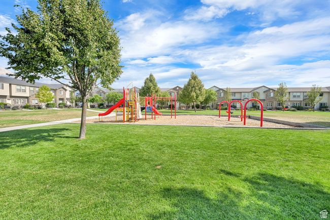 Community playground with a residential view and a lawn | Image 34