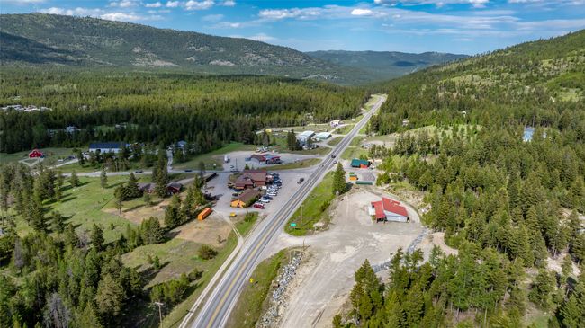 Aerial overview of property's location with a heavily wooded area and mountains | Image 69