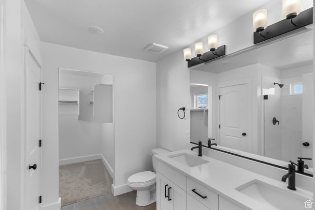 (Picture of Previously Build Home) Primary bath with double sinks, 5x3 shower w/ dual shower heads, White Cabinets & Quartz Countertops | Image 6