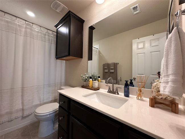 Bathroom with vanity, toilet, and tile patterned flooring | Image 12